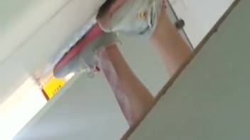 Asian women with unshaven vaginas urinating in the bathroom via a hidden camera