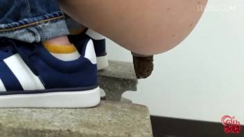 Asian chick expels solid poop